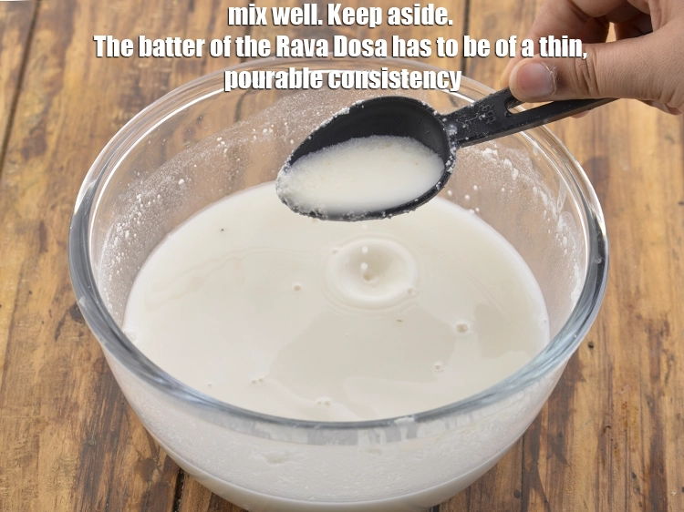 Step 9 – <p>Mix well. Keep aside. The batter of the <strong>Rava Dosa</strong> has to be of a …
