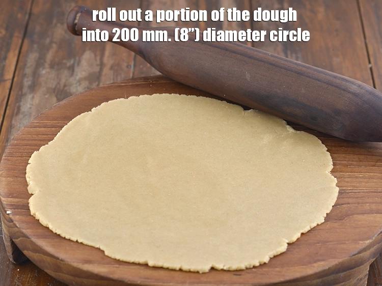 Step 12 – <p><span style="background-color:rgb(255,255,255);color:rgb(0,0,0);">Roll out a portion of the dough into 200 mm. (8”) diameter circle.</span></p>