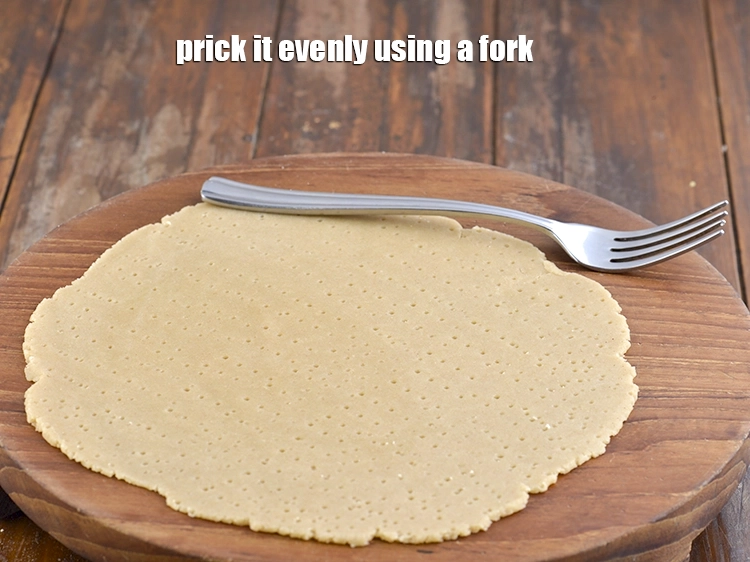 Step 13 – <p><span style="background-color:rgb(255,255,255);color:rgb(0,0,0);">Prick it evenly using a fork.</span></p>