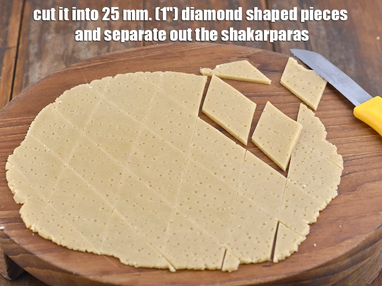 Step 14 – <p>Cut it into 25 mm. (1") <strong>diamond shaped pieces</strong> and <strong>separate</strong> out the shakarparas. <span …