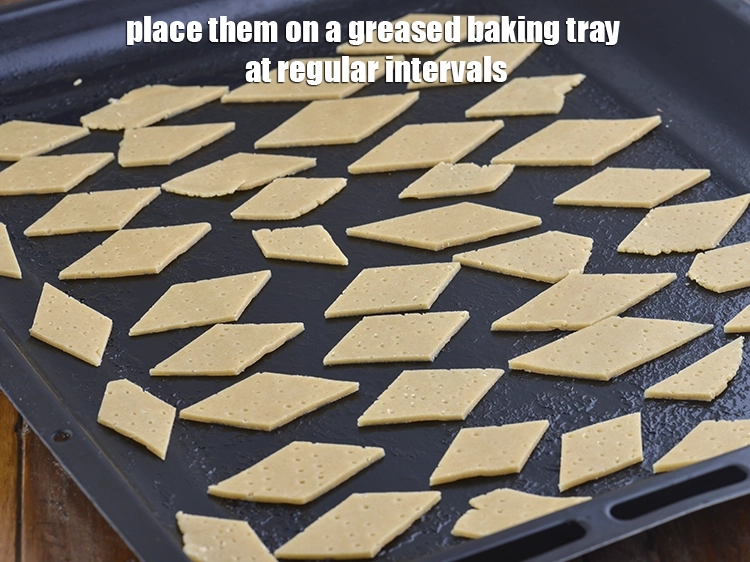 Step 16 – <p><span style="background-color:rgb(255,255,255);color:rgb(0,0,0);">Place them on a greased baking tray at regular intervals.</span></p>