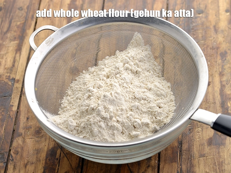 Step 6 – <p>Add the <span style="background-color:rgb(255,255,255);color:rgb(0,0,0);">3/4 cup </span><a href="https://www.tarladalal.com/glossary-whole-wheat-flour-gehun-ka-atta-gehun-ka-aata-429i"><u>whole wheat flour (gehun ka atta)</u></a><u>.</u></p>