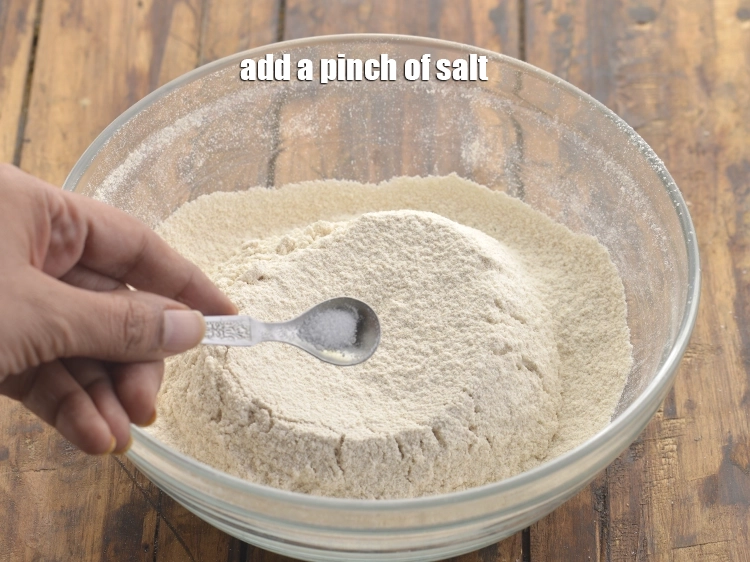 Step 8 – <p><span style="background-color:rgb(255,255,255);color:rgb(0,0,0);">Add a pinch of </span><a href="https://www.tarladalal.com/glossary-salt-namak-table-salt-418i"><u>salt</u></a><span style="background-color:rgb(255,255,255);color:rgb(0,0,0);">. They enhance the sweetness in the dough …