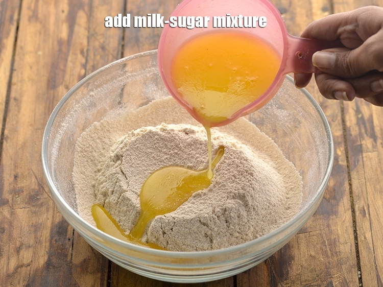Step 9 – <p><span style="background-color:rgb(255,255,255);color:rgb(0,0,0);">Gradually, add the <strong>milk-sugar mixture</strong> and combine all the ingredients. Ensure it is <strong>cooled …