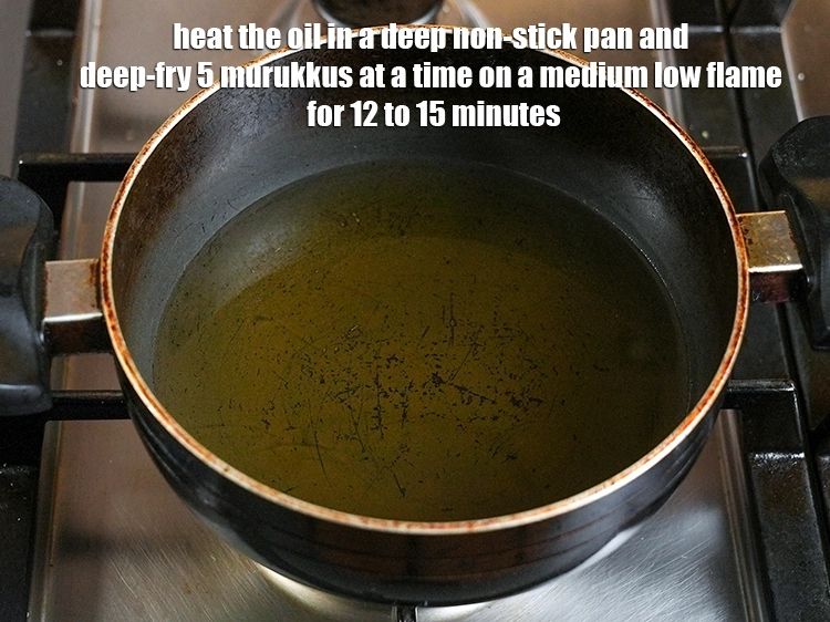 Step 12 – <p><span style="background-color:rgb(255,255,255);color:rgb(0,0,0);">Heat the </span><a href="https://www.tarladalal.com/glossary-oil-671i"><u>oil</u></a><span style="background-color:rgb(255,255,255);color:rgb(0,0,0);"> in a deep non-stick pan and deep-fry 5 murukkus …