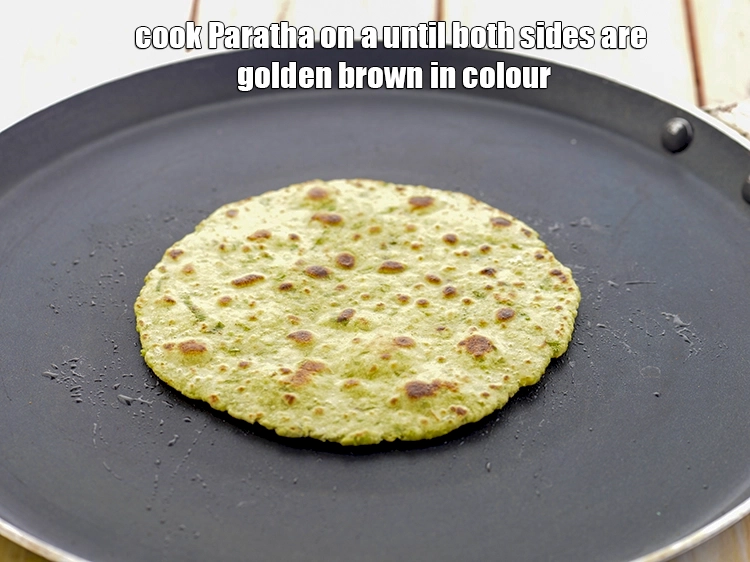 Step 23 – <p>Cook <strong>Paratha</strong> on a until both sides are golden brown in colour.</p>