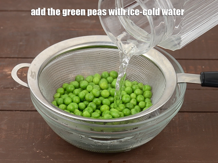 Step 7 – <p>Put the <strong>green peas</strong> in a bowl of <strong>ice-cold water</strong>. This is to preserve the …