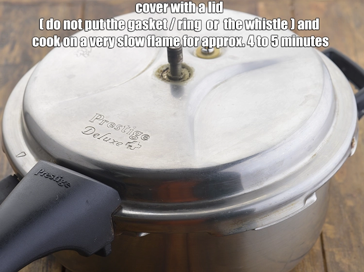 Step 5 – <p>Cover with a lid <strong>(do not put the gasket/ring or the whistle)</strong> and <strong>cook</strong> on …