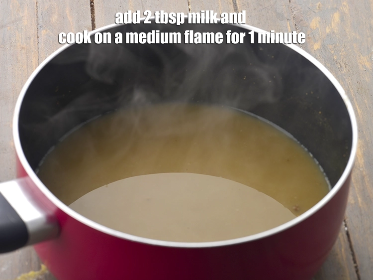 Step 5 – <p><span style="background-color:rgb(255,255,255);color:rgb(0,0,0);">Add the 2 tbsp. </span><a href="https://www.tarladalal.com/glossary-milk-doodh-full-cream-milk-514i"><u>milk</u></a><span style="background-color:rgb(255,255,255);color:rgb(0,0,0);"> and cook on a medium flame for …