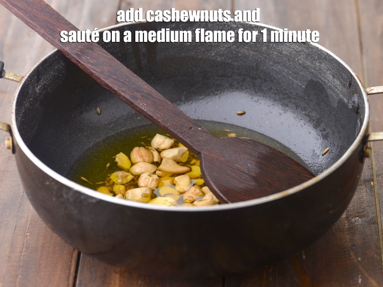 Step 12 – <p><span style="background-color:rgb(255,255,255);color:rgb(0,0,0);">Add the 2 tbsp </span><a href="https://www.tarladalal.com/glossary-cashew-nuts-kaju-840i"><u>cashew nuts (kaju) </u></a><span style="background-color:rgb(255,255,255);color:rgb(0,0,0);">, broken into pieces and …