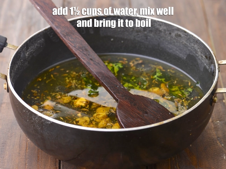 Step 14 – <p><span style="background-color:rgb(255,255,255);color:rgb(0,0,0);">Add 1½ cups of <strong>water</strong>, mix well and bring it to boil.</span></p>
