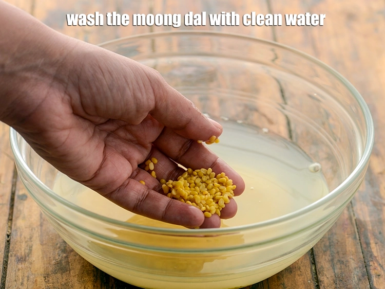 Step 2 – <p>Wash the <strong>moong dal </strong>with clean water.</p>