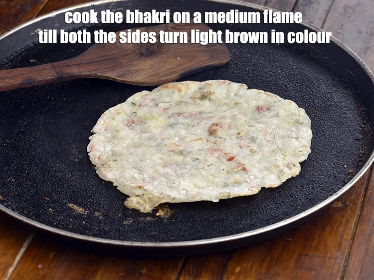 Step 8 – <p><span style="background-color:rgb(255,255,255);color:rgb(0,0,0);">Heat a non-stick tava (griddle) and cook the <strong>bhakri</strong> on a medium flame till …