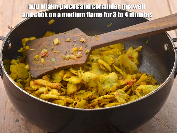 Step 14 – <p><span style="background-color:rgb(255,255,255);color:rgb(0,0,0);">Add the <strong>bhakri pieces</strong> and coriander, mix well and cook on a medium flame …