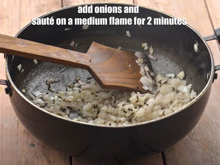 Step 11 – <p><span style="background-color:rgb(255,255,255);color:rgb(0,0,0);">Add the 1/2 cup </span><a href="https://www.tarladalal.com/glossary-onions-pyaz-pyaaz-kanda-548i#ing_2327"><u>chopped onion</u></a><span style="background-color:rgb(255,255,255);color:rgb(0,0,0);"> and <strong>sauté</strong> on a medium flame …