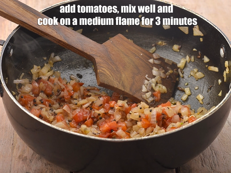 Step 12 – <p><span style="background-color:rgb(255,255,255);color:rgb(0,0,0);">Add the 1/4 cup </span><a href="https://www.tarladalal.com/glossary-tomatoes-tamatar-639i#ing_2361"><u>chopped tomato</u></a><span style="background-color:rgb(255,255,255);color:rgb(0,0,0);">, mix well and cook on a …
