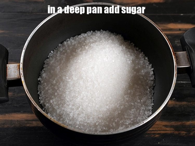 Step 1 – <p><span style="background-color:rgb(255,255,255);color:rgb(0,0,0);">To make the <strong>Imarti</strong>, In a deep non-stick pan, add 3 cups </span><a href="https://www.tarladalal.com/glossary-sugar-chini-shakkar-278i"><u>sugar</u></a><u>.</u></p>