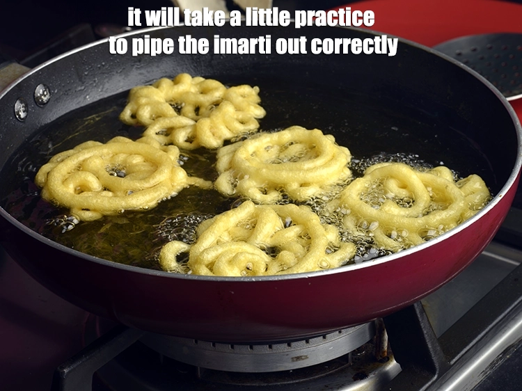 Step 17 – <p>It will take a little practice to pipe the imarti out correctly.</p>