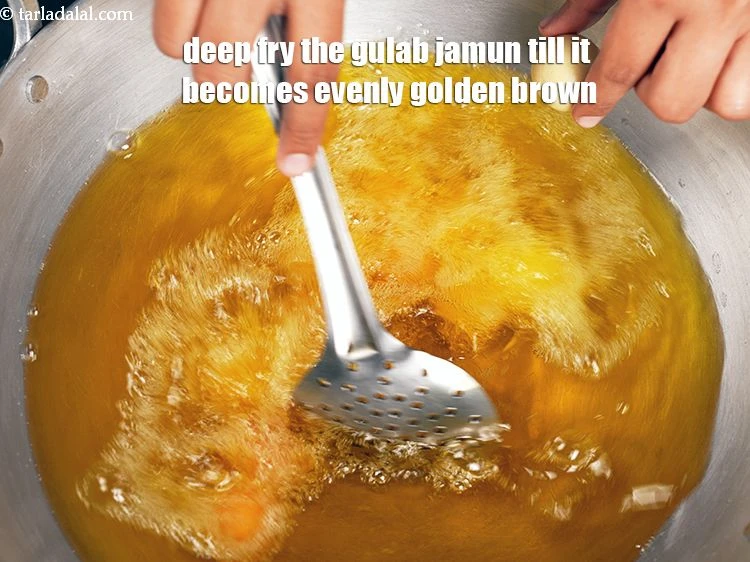Step 19 – <p><span style="background-color:rgb(255,255,255);color:rgb(0,0,0);">Deep fry the <strong>gulab jamun</strong> till it becomes evenly golden brown. Keep stirring while …