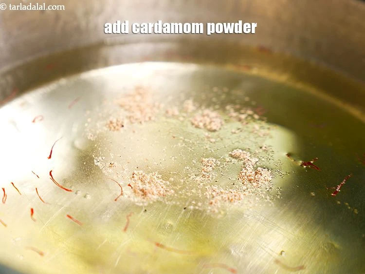 Step 8 – <p><span style="background-color:rgb(255,255,255);color:rgb(0,0,0);">Add 1/4 tsp&nbsp;</span><a href="https://www.tarladalal.com/glossary-cardamom-powder-elaichi-powder-265i"><u>cardamom (elaichi) powder</u></a><span style="background-color:rgb(255,255,255);color:rgb(0,0,0);">.</span></p>