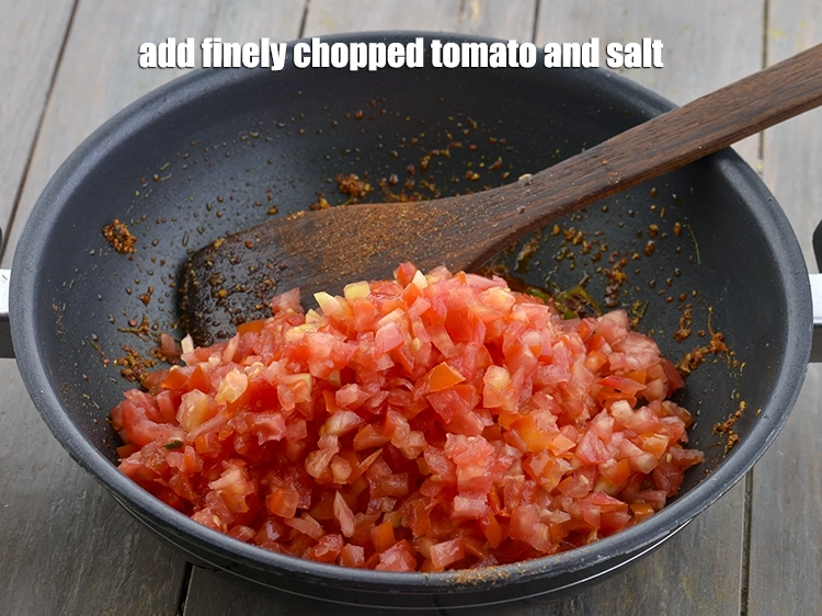 Step 9 – <p><span style="background-color:rgb(255,255,255);color:rgb(0,0,0);">Add the 2 cups finely </span><a href="https://www.tarladalal.com/glossary-tomatoes-tamatar-639i#ing_2361"><u>chopped tomato</u></a><span style="background-color:rgb(255,255,255);color:rgb(0,0,0);"> and </span><a href="https://www.tarladalal.com/glossary-salt-namak-table-salt-418i"><u>salt </u></a><span style="background-color:rgb(255,255,255);color:rgb(0,0,0);">to …