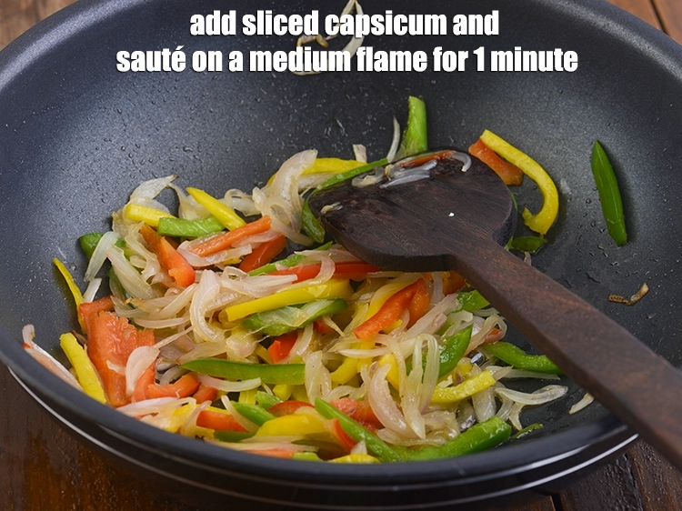 Step 24 – <p>Add the <span style="background-color:rgb(255,255,255);color:rgb(0,0,0);">1/2 cup colour </span><a href="https://www.tarladalal.com/glossary-capsicum-shimla-mirch-bell-pepper-163i#ing_2312"><u>sliced capsicum</u></a><u>.</u> and <strong>sauté</strong> on a medium flame …