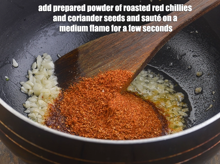 Step 8 – <p>Add the <strong>prepared powder</strong> of roasted red chillies and coriander seeds and <strong>sauté</strong> on a …