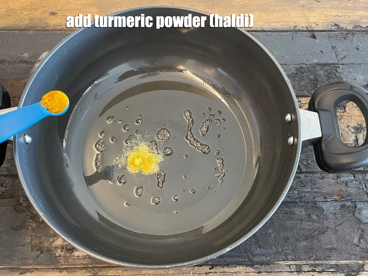 Step 6 – <html><head></head><body><p>Add&nbsp;1/4 tsp&nbsp;<a href="glossary-turmeric-powder-haldi-645i">turmeric powder (haldi)</a>.</p></body></html>
