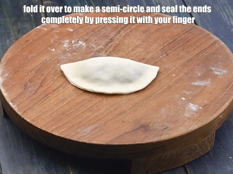 Step 16 – <p><span style="background-color:rgb(255,255,255);color:rgb(0,0,0);"><strong>Fold </strong>it over to make a semi-circle and seal the ends completely by pressing …