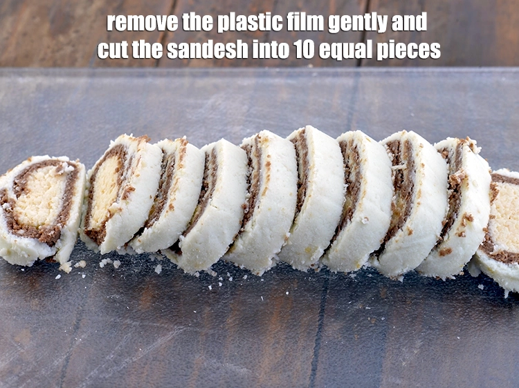 Step 9 – <p><span style="background-color:rgb(255,255,255);color:rgb(0,0,0);"><strong>Remove</strong> <strong>the plastic</strong> film gently and <strong>cut</strong> the <strong>sandesh</strong> into 10 equal pieces.</span></p>