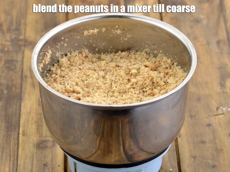 Step 3 – <p><span style="background-color:rgb(255,255,255);color:rgb(0,0,0);"><strong>Blend</strong> the peanuts in a mixer till coarse. Keep aside.</span></p>