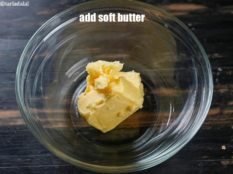 Step 8 – <p><span style="background-color:rgb(255,255,255);color:rgb(0,0,0);">In another bowl, add 3/4 cup softened </span><a href="https://www.tarladalal.com/glossary-butter-makhan-233i"><u>butter</u></a><u>.</u></p>