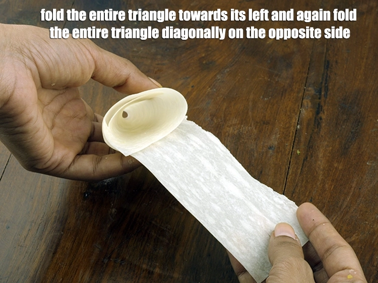 Step 11 – <p><span style="background-color:rgb(255,255,255);color:rgb(0,0,0);">Fold the entire triangle towards its left and again fold the entire triangle diagonally …