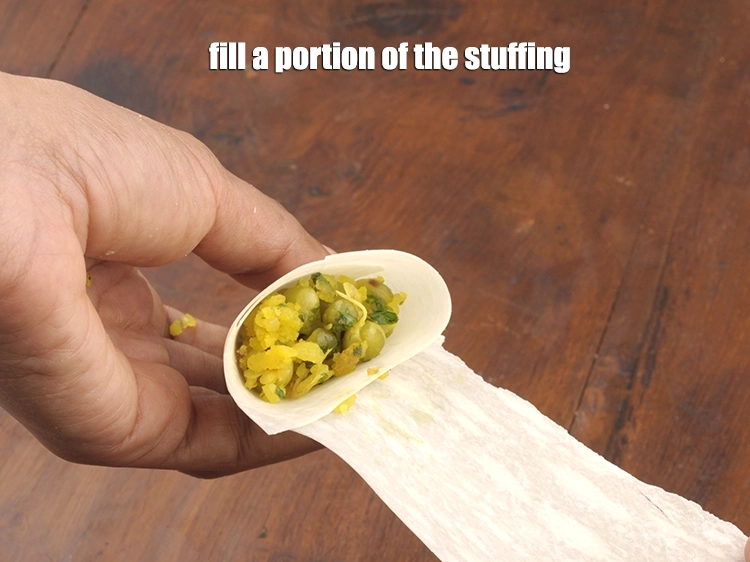 Step 12 – <p><span style="background-color:rgb(255,255,255);color:rgb(0,0,0);">Fill a portion of the <strong>stuffing</strong>.</span></p>