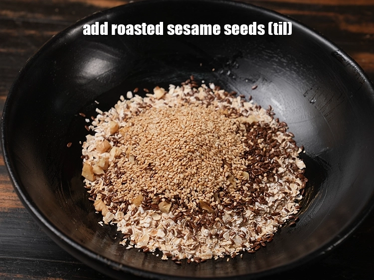 Step 7 – <p>Add the <span style="background-color:rgb(255,255,255);color:rgb(0,0,0);">2 tbsp </span><a href="https://www.tarladalal.com/glossary-sesame-seeds-til-gingelly-seeds-612i#ing_3277"><u>roasted sesame seeds (til)</u></a><u>. </u><span style="background-color:rgb(255,255,255);color:rgb(0,0,0);">and <strong>mix very well</strong>. …