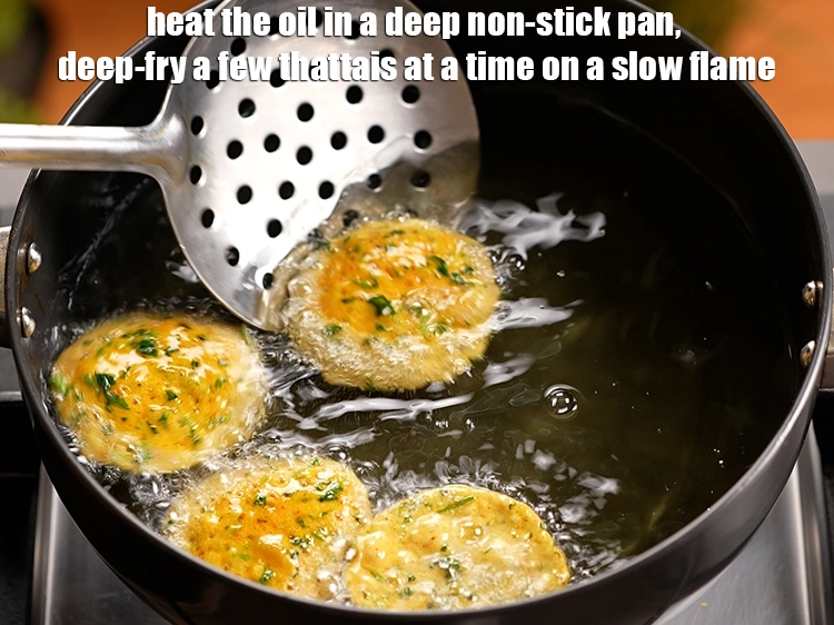 Step 7 – <p><span style="background-color:rgb(255,255,255);color:rgb(0,0,0);">Heat the </span><a href="https://www.tarladalal.com/glossary-oil-671i"><u>oil</u></a><span style="background-color:rgb(255,255,255);color:rgb(0,0,0);"> in a deep non-stick pan, <strong>deep-fry</strong> a few <strong>thattais</strong> …