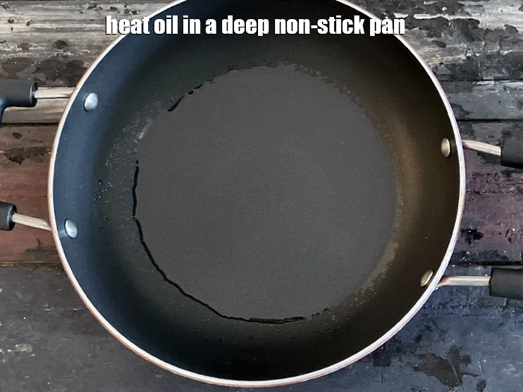 Step 5 – <p><span style="background-color:rgb(255,255,255);color:rgb(0,0,0);">Heat the 1 tbsp </span><a href="https://www.tarladalal.com/glossary-oil-671i"><u>oil</u></a><span style="background-color:rgb(255,255,255);color:rgb(0,0,0);"> in a deep non-stick pan.</span></p>