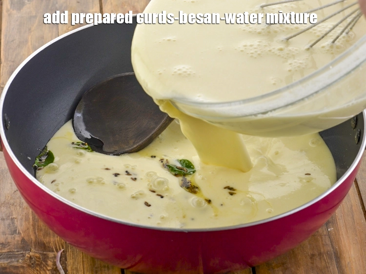 Step 7 – <p>Add the prepared <strong>curds-besan-water mixture</strong>.</p>