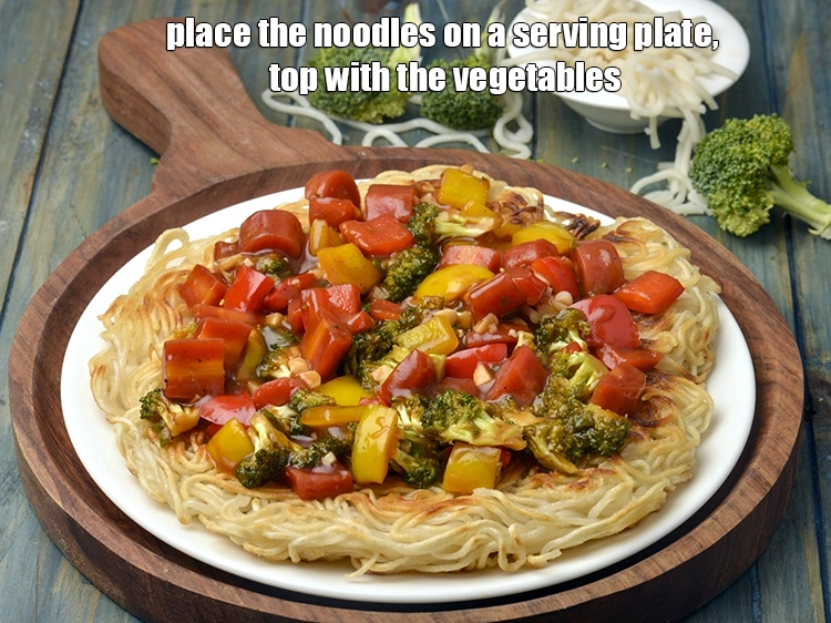 Step 9 – <p><span style="background-color:rgb(255,255,255);color:rgb(0,0,0);">Place the <strong>noodles</strong> on a serving plate, top with the <strong>vegetables</strong>.</span></p>