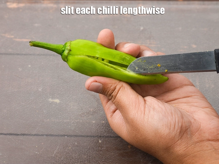 Step 2 – <p><span style="background-color:rgb(255,255,255);color:rgb(0,0,0);">Slit each chilli lengthwise.</span></p>