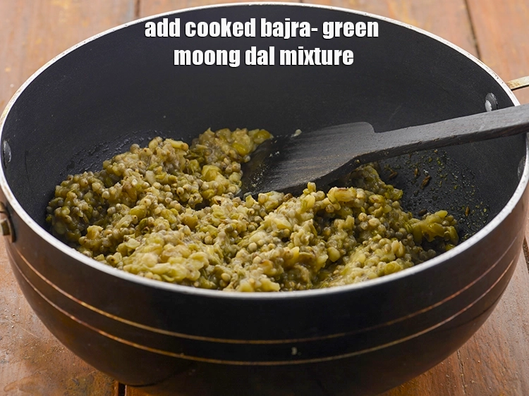 Step 18 – <p>Add the <strong>cooked bajra- green moong dal mixture</strong>.</p>