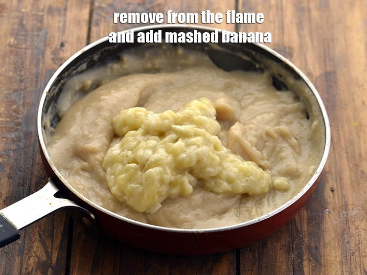 Step 20 – <p>Remove from the flame and add the <span style="background-color:rgb(255,255,255);color:rgb(0,0,0);">1/4 cup </span><a href="https://www.tarladalal.com/glossary-banana-kela-17i#ing_2966"><u>mashed banana</u></a>.&nbsp;</p>