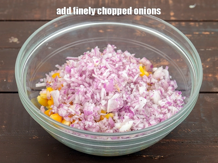 Step 18 – <p><span style="background-color:rgb(255,255,255);color:rgb(0,0,0);">Add 1/2 cup&nbsp;finely&nbsp;</span><a href="https://www.tarladalal.com/glossary-chopped-onions-722i"><u>chopped onions</u></a><span style="background-color:rgb(255,255,255);color:rgb(0,0,0);">.</span></p>