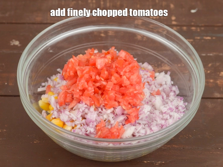 Step 19 – <p><span style="background-color:rgb(255,255,255);color:rgb(0,0,0);">Add 1/4 cup&nbsp;finely&nbsp;</span><a href="https://www.tarladalal.com/glossary-chopped-tomatoes-779i"><u>chopped tomatoes</u></a><span style="background-color:rgb(255,255,255);color:rgb(0,0,0);">.</span></p>