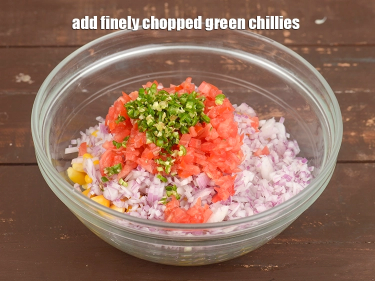 Step 20 – <p><span style="background-color:rgb(255,255,255);color:rgb(0,0,0);">Add 1 tsp finely </span><a href="https://www.tarladalal.com/glossary-green-chillies-hari-mirch-331i#ing_2388"><u>chopped green chillies</u></a><u>.</u></p>