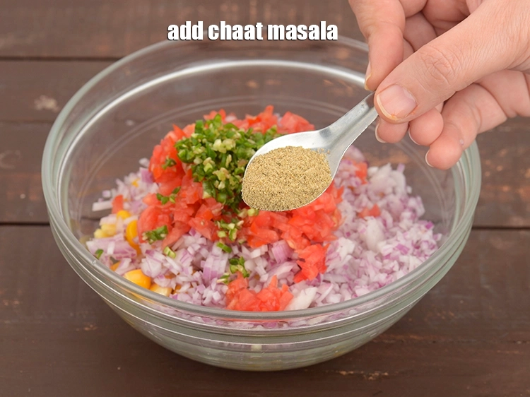 Step 22 – <p><span style="background-color:rgb(255,255,255);color:rgb(0,0,0);">Add 1 1/2 tsp&nbsp;</span><a href="https://www.tarladalal.com/chaat-masala-homemade-chaat-masala-recipe-164r"><u>chaat masala</u></a><span style="background-color:rgb(255,255,255);color:rgb(0,0,0);">.</span></p>