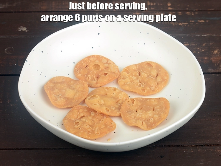 Step 25 – <p><span style="background-color:rgb(255,255,255);color:rgb(0,0,0);"><strong>Just before serving</strong>, arrange 6 </span><a href="https://www.tarladalal.com/glossary-papdi-chaat-chaat-ki-puri-1999i"><u>papdis</u></a><span style="background-color:rgb(255,255,255);color:rgb(0,0,0);"> on a serving plate.</span></p>