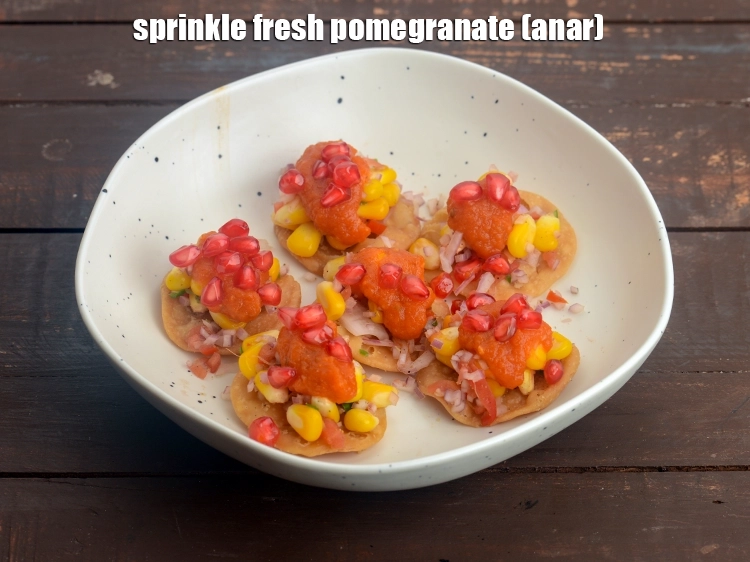Step 28 – <p><span style="background-color:rgb(255,255,255);color:rgb(0,0,0);">Sprinkle 1/3 cup&nbsp;fresh&nbsp;</span><a href="https://www.tarladalal.com/glossary-pomegranate-anar-587i"><u>pomegranate (anar)</u></a></p>