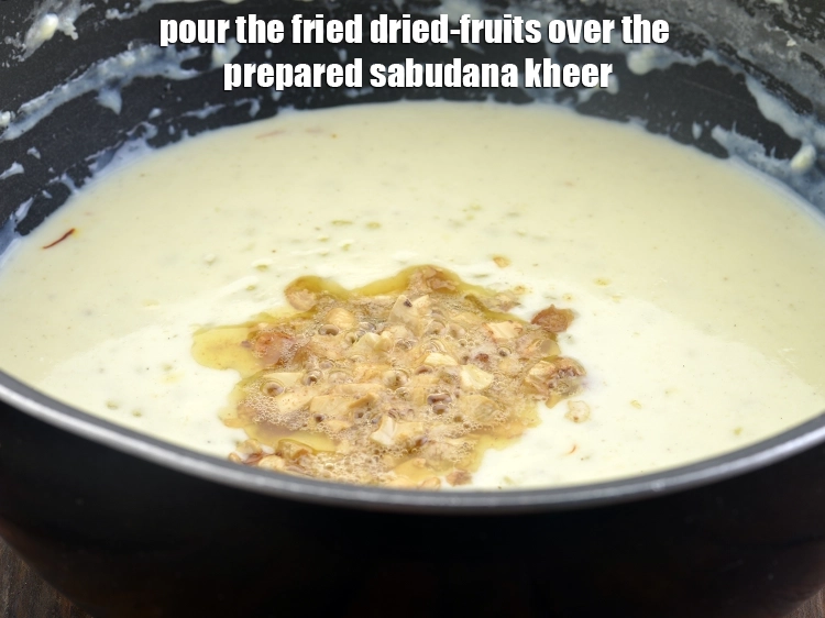 Step 18 – <p><span style="background-color:rgb(255,255,255);color:rgb(0,0,0);">Pour the fried dried-fruits over the prepared </span><strong>sabudana kheer</strong><span style="background-color:rgb(255,255,255);color:rgb(0,0,0);">.</span></p>