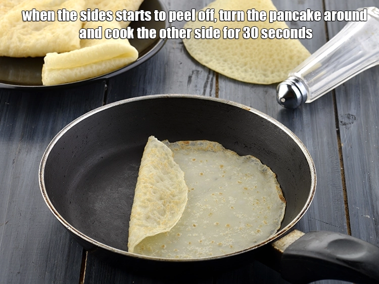 Step 14 – <p><span style="background-color:rgb(255,255,255);color:rgb(0,0,0);">When the sides starts to peel off, turn the <strong>pancake</strong> around and cook the …